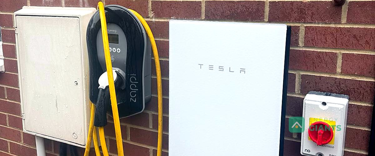 A Tesla Powerwall 3 mounted on the brick wall of a house in Morley, beside the meter box