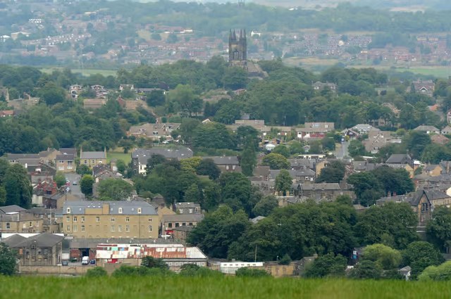 Rooftops and a church tower across a Kirklees town, West Yorkshire
