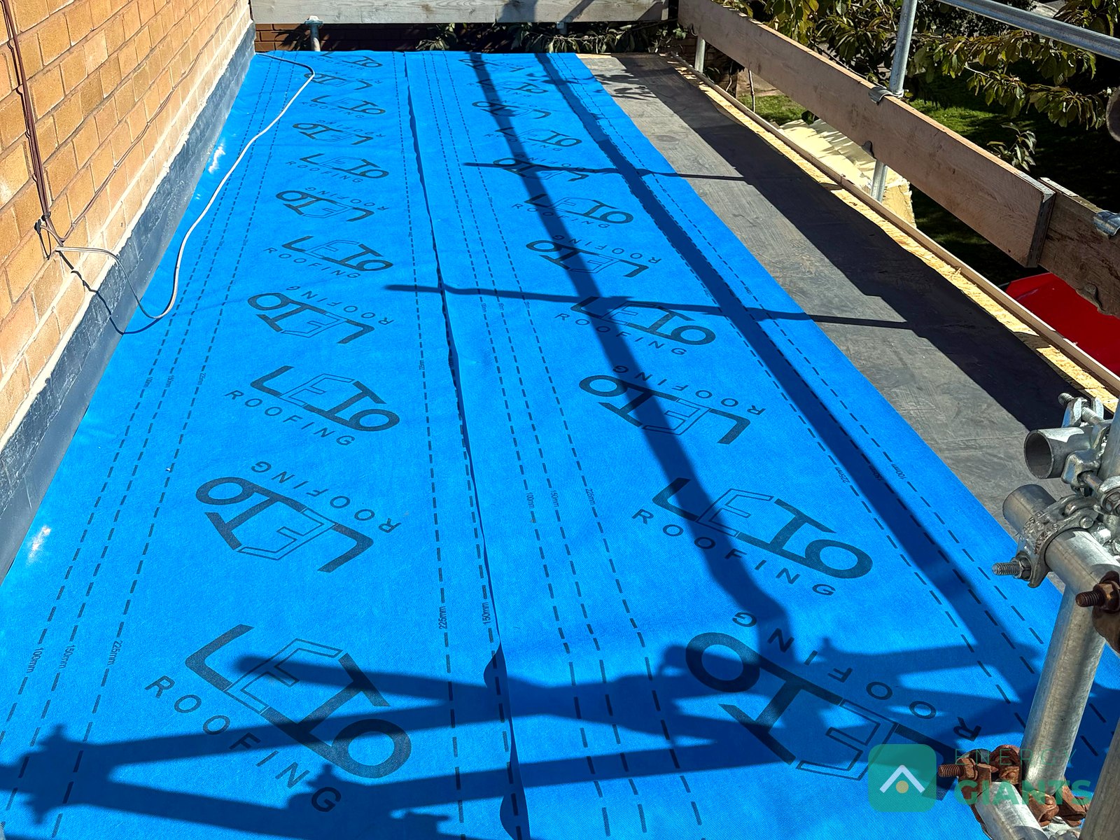 Blue vapour control layer laid across the garage roof deck