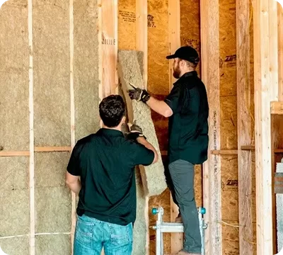 Energy Giants team installing an internal wall insulation system