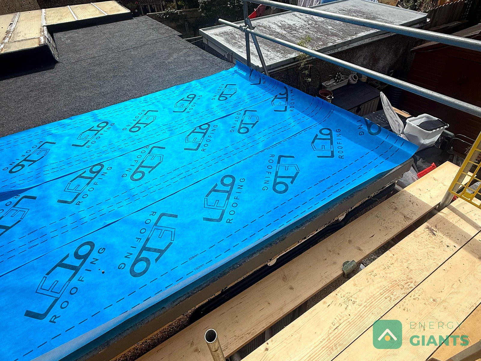 Blue vapour control layer laid across the extension roof deck