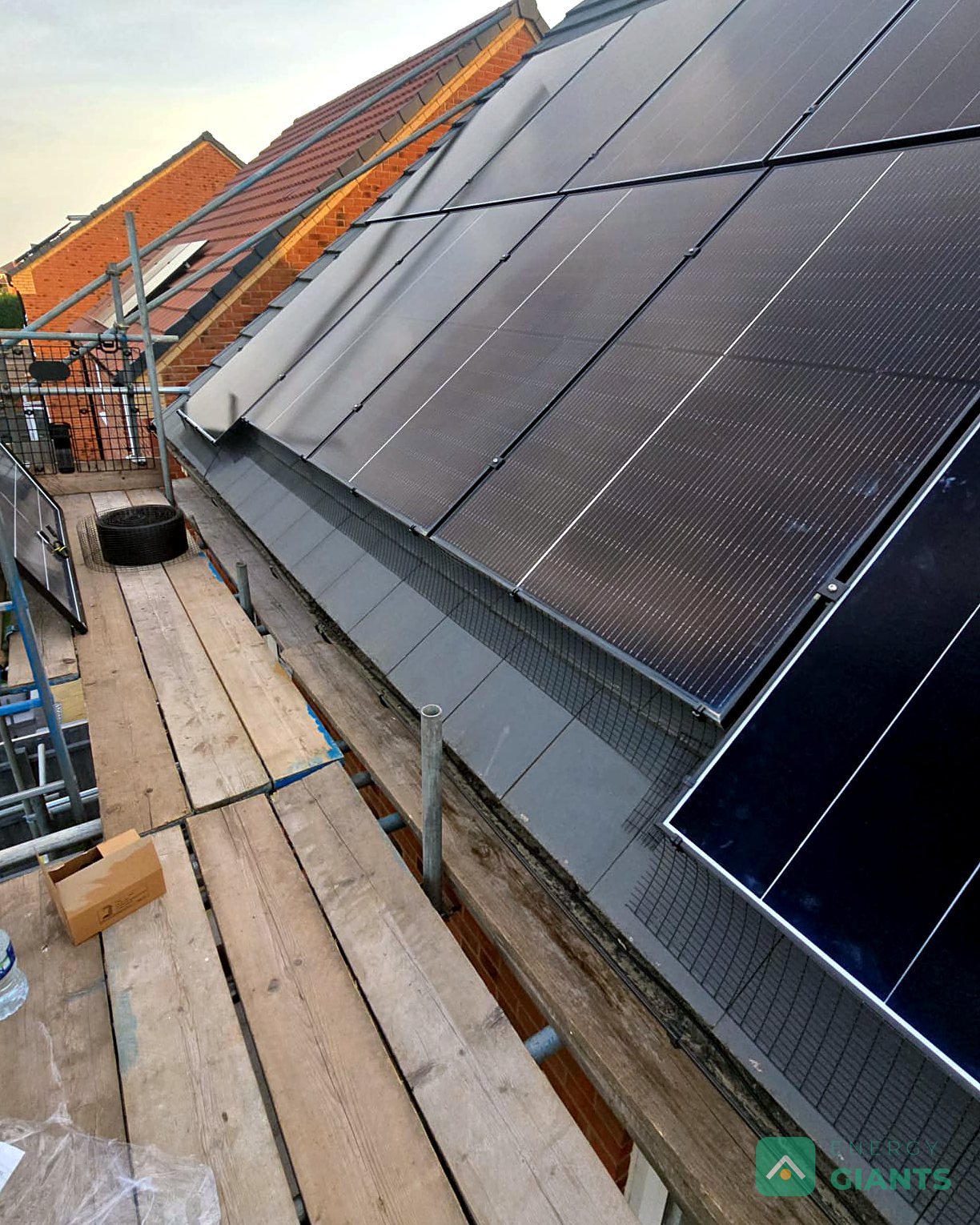 The new Aiko panels on the roof seen from the scaffold, with bird mesh round the edge