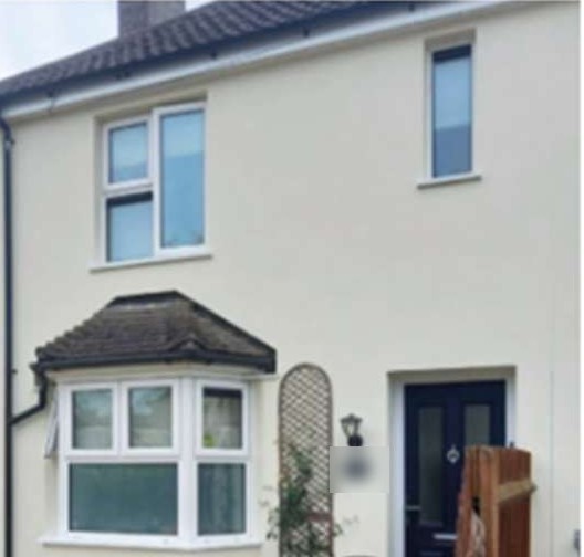 A rendered semi-detached house after external wall insulation, County Durham
