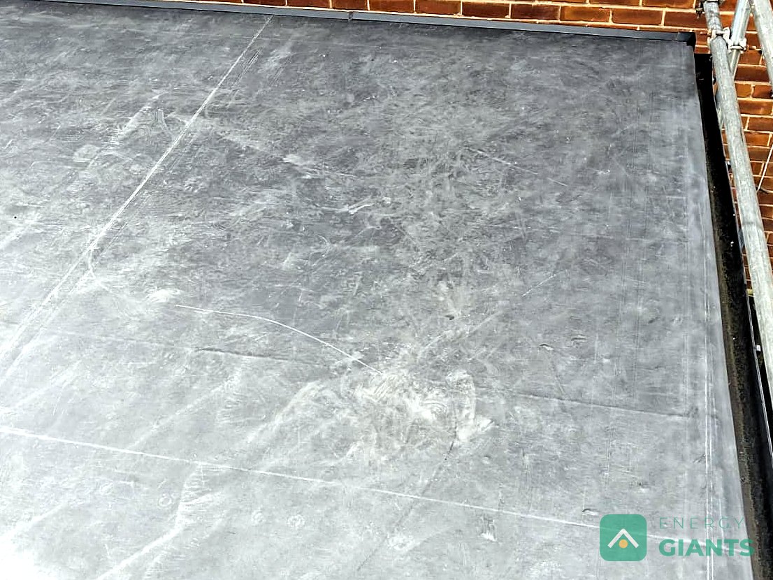 Black EPDM rubber membrane bonded to the new deck on the extension roof