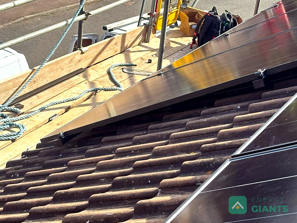 Panels going onto the roof with the scaffold still up