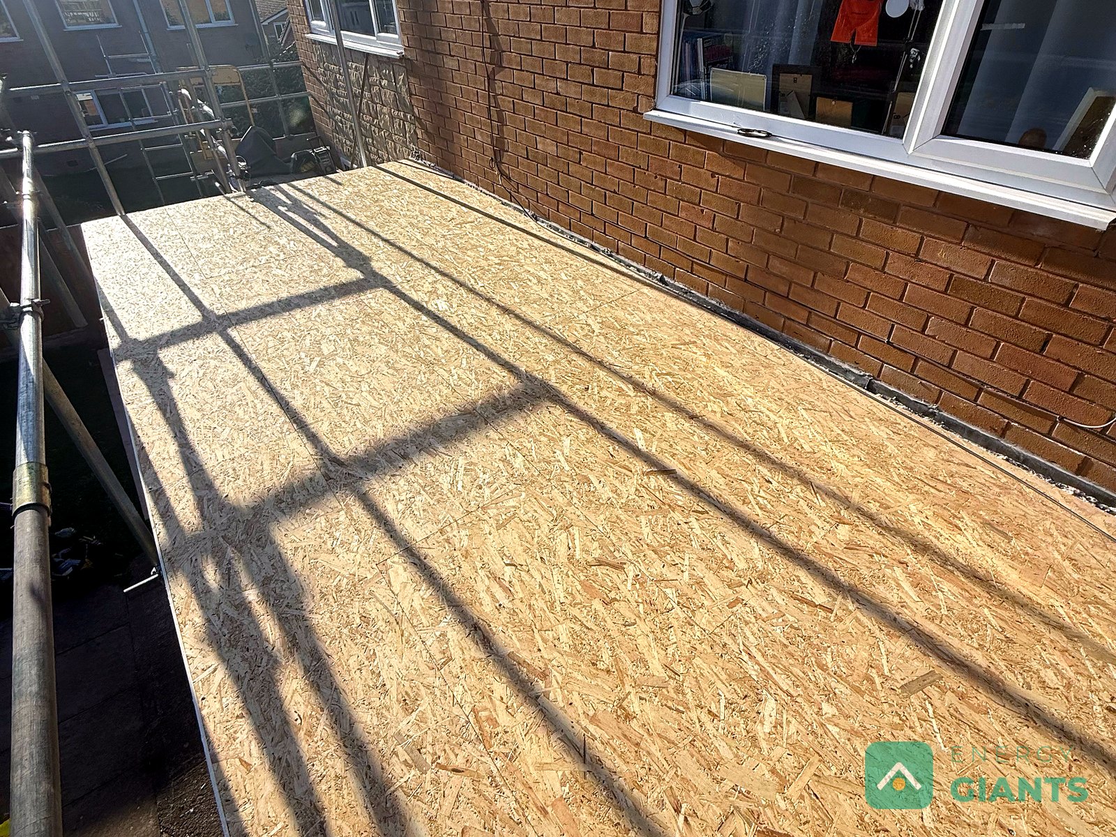 New OSB deck laid over the insulation on the garage roof