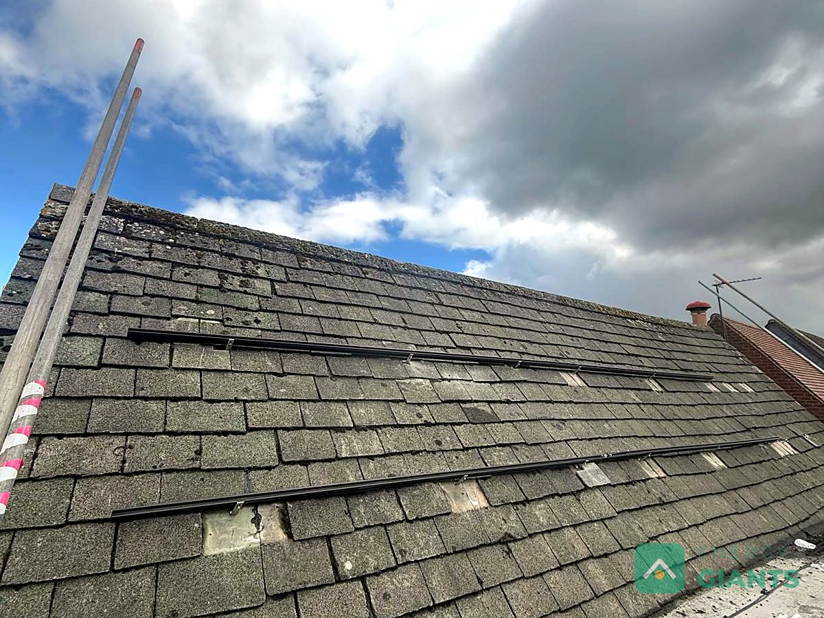 Mounting rails being fixed across the tiles