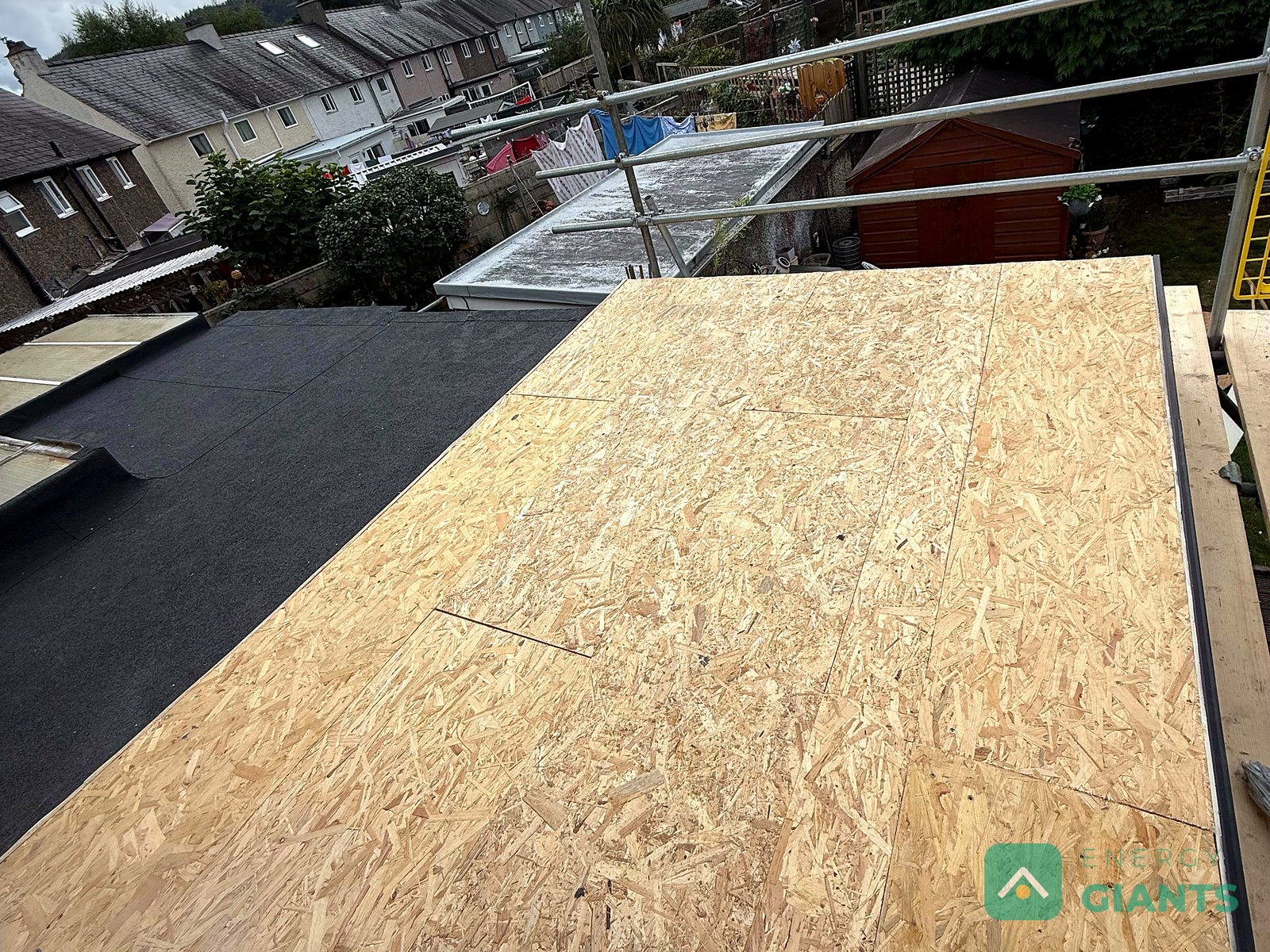 New OSB deck laid over the insulation on the extension roof