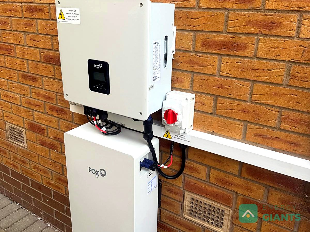 The Fox ESS inverter and battery on the outside side wall
