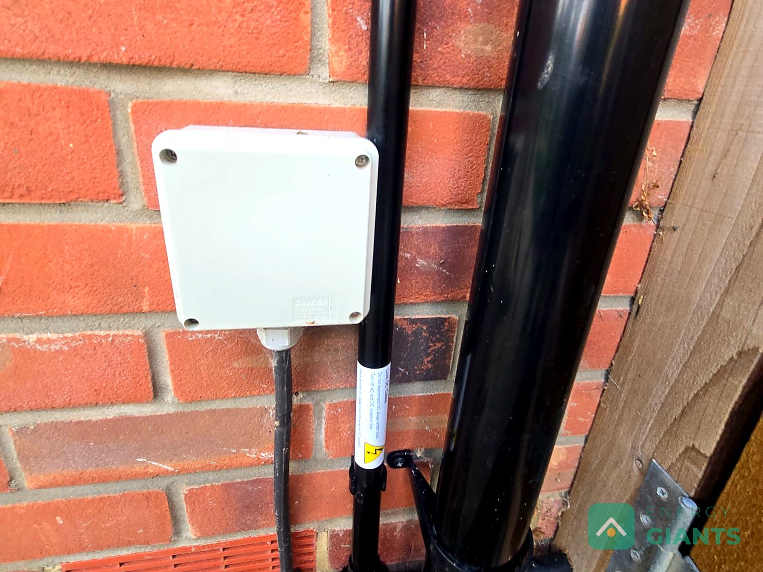 A cable laid along the base of a wall on its way to the garage