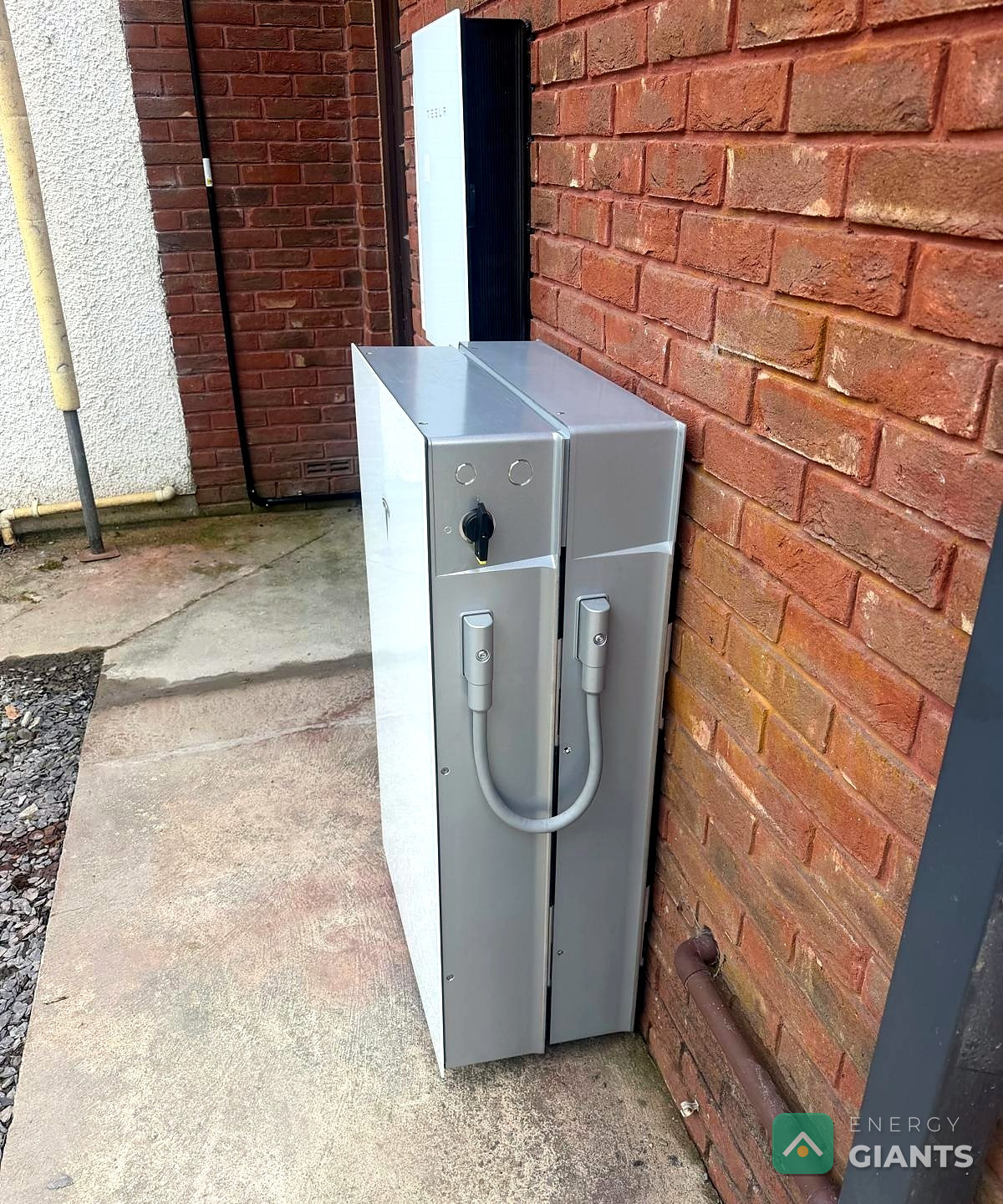 The Tesla Powerwall 3 expansion unit on the outside wall of the house