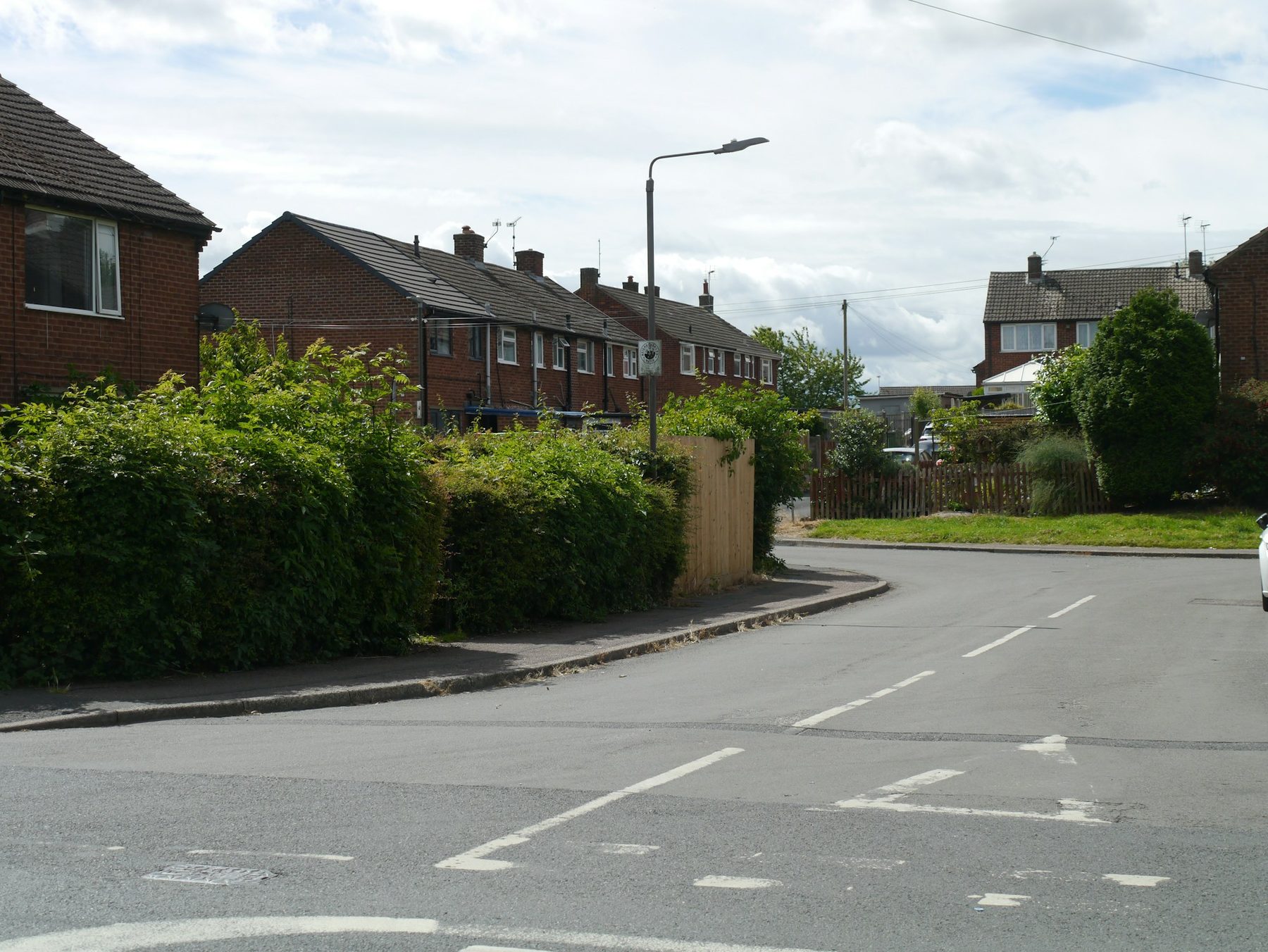 A street of brick semi-detached homes. Illustrative image